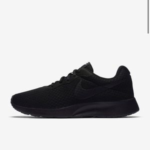 All black Nike tennis shoes